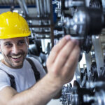 worker inspecting parts automobile industry factory production line