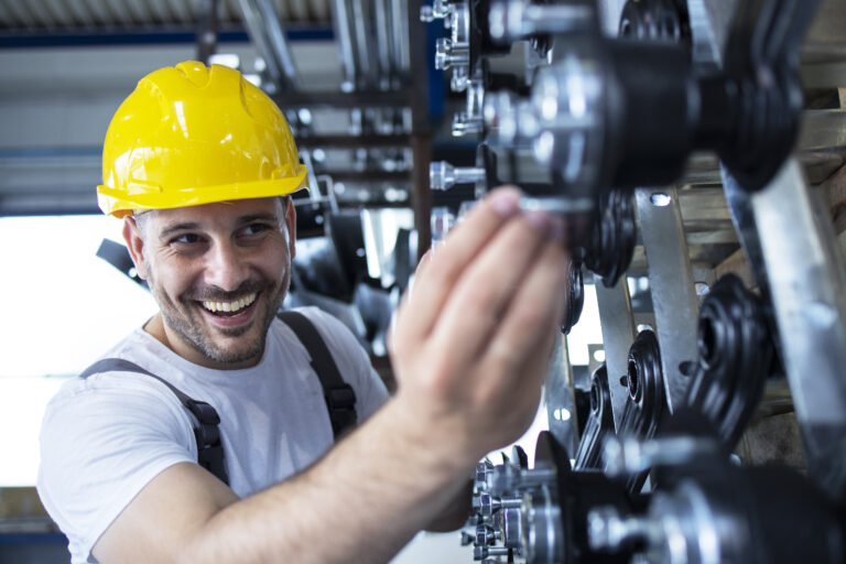 worker inspecting parts automobile industry factory production line